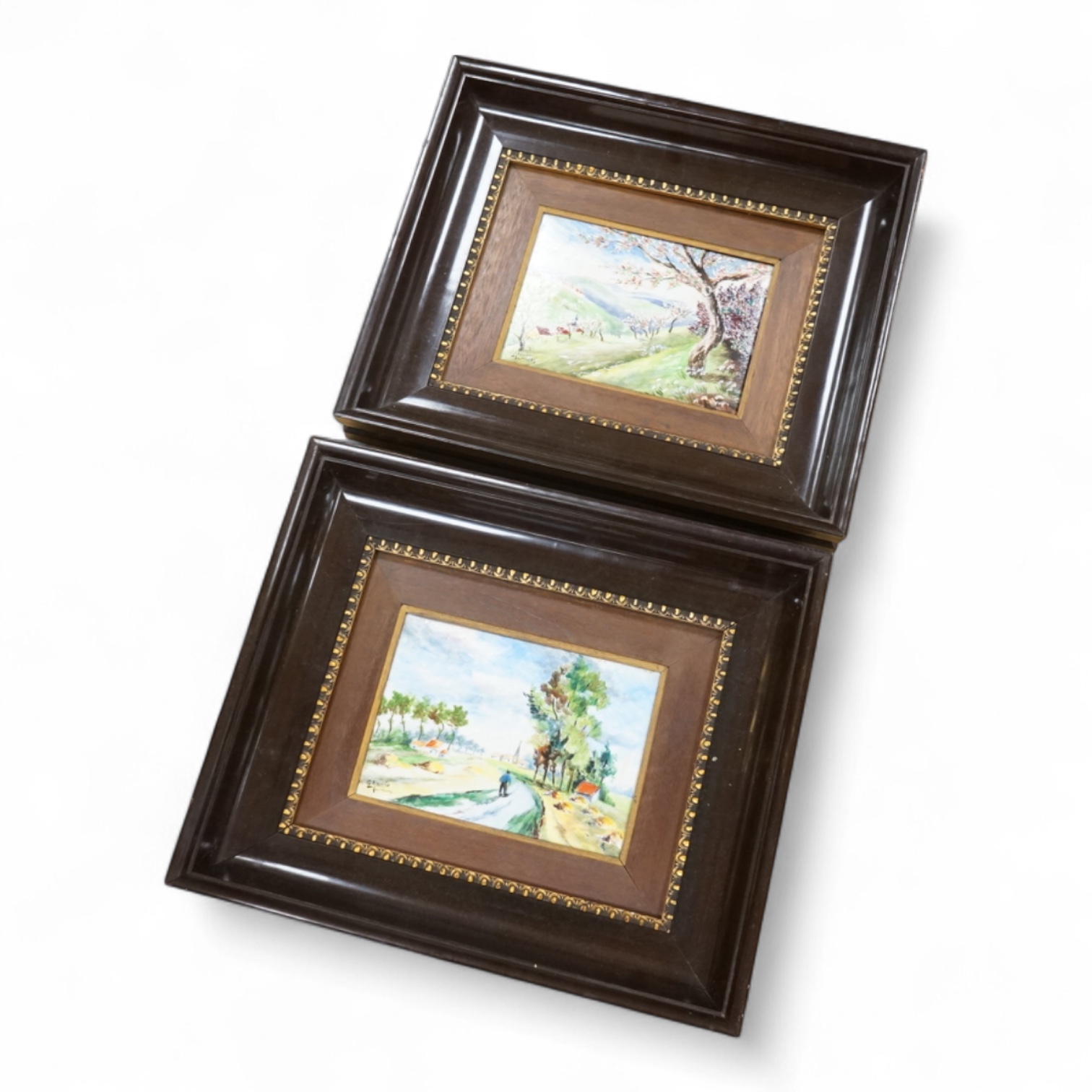 A pair of Limoges porcelain plaques depicting landscapes, signed G Meunier, framed, 30 x 35cm